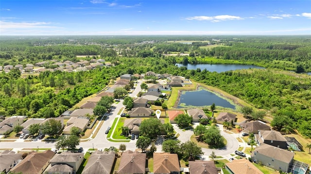 bird's eye view featuring a water view, a view of trees, and a residential view