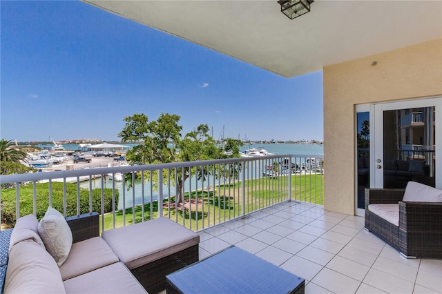 425 150th Ave Unit 2301, Madeira Beach, FL 33708 - balcony with an outdoor hangout area and a water view