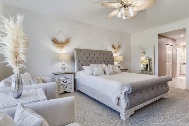 425 150th Ave Unit 2301, Madeira Beach, FL 33708 - bedroom with connected bathroom, carpet floors, and a ceiling fan