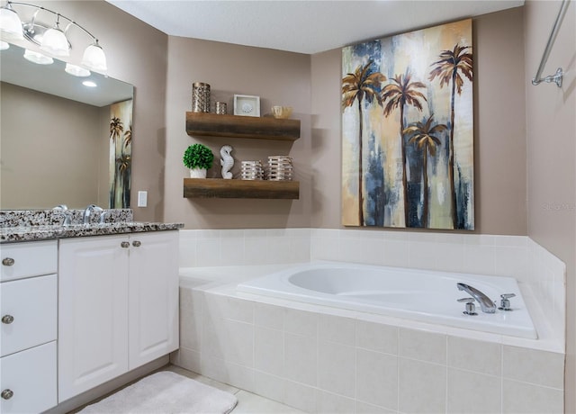 425 150th Ave Unit 2301, Madeira Beach, FL 33708 - full bath featuring vanity, a garden tub, and tile patterned floors