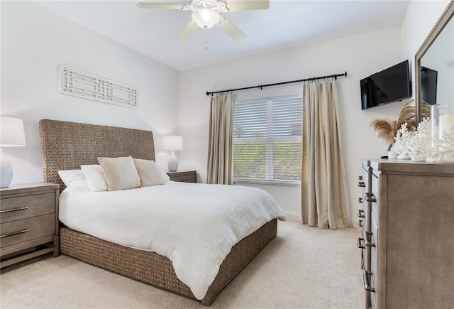 425 150th Ave Unit 2301, Madeira Beach, FL 33708 - bedroom with light colored carpet and ceiling fan