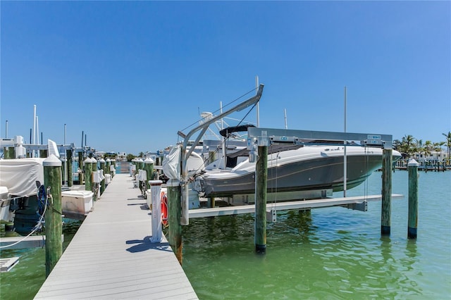 425 150th Ave Unit 2301, Madeira Beach, FL 33708 - dock area with boat lift and a water view
