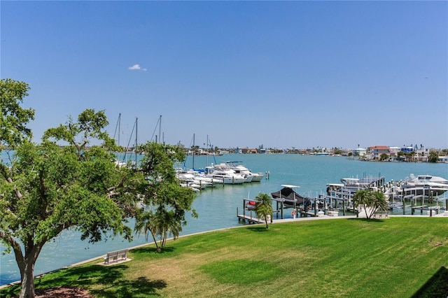 425 150th Ave Unit 2301, Madeira Beach, FL 33708 - dock featuring a lawn, a water view, and boat lift