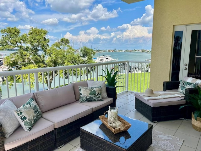 425 150th Ave Unit 2301, Madeira Beach, FL 33708 - balcony with a water view and an outdoor living space