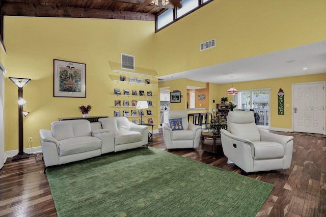 50 Balsam Dr, Oldsmar, FL 34677 - living room featuring wooden ceiling, high vaulted ceiling, dark wood-type flooring, baseboards, and beamed ceiling