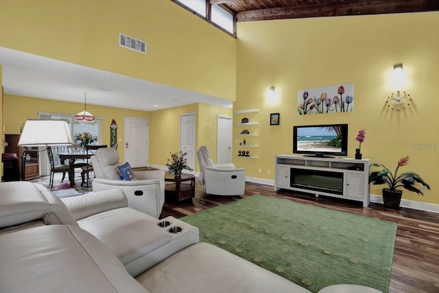 50 Balsam Dr, Oldsmar, FL 34677 - living room featuring baseboards, dark wood-style flooring, wood ceiling, and a towering ceiling