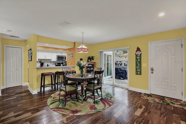 50 Balsam Dr, Oldsmar, FL 34677 - dining area featuring dark wood-style flooring, baseboards, and recessed lighting