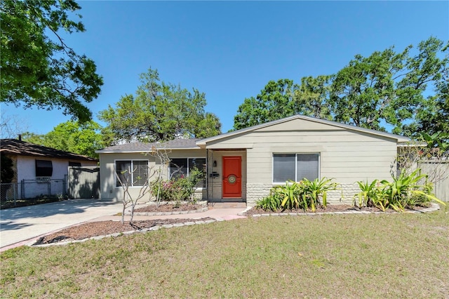 ranch-style house with fence and a front yard