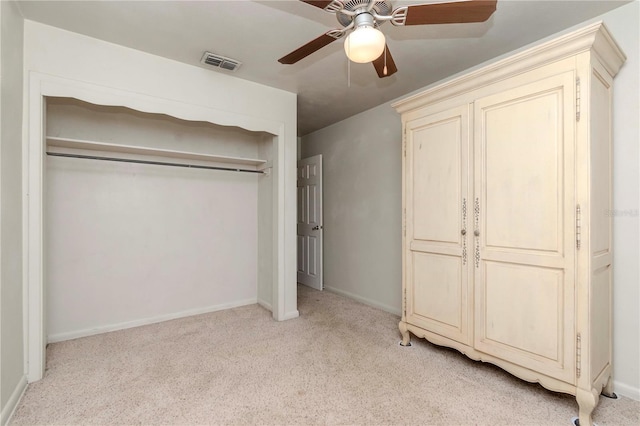 unfurnished bedroom featuring visible vents, ceiling fan, baseboards, and light carpet