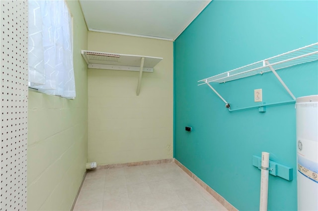 clothes washing area with ornamental molding