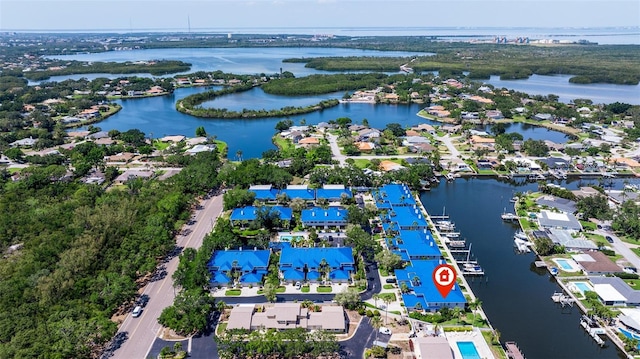drone / aerial view with a residential view and a water view