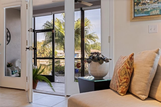 entryway featuring ceiling fan and tile patterned flooring