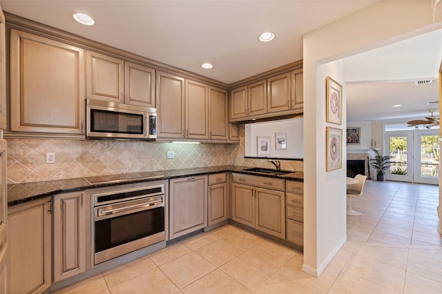 kitchen with visible vents, light tile patterned floors, appliances with stainless steel finishes, and a sink