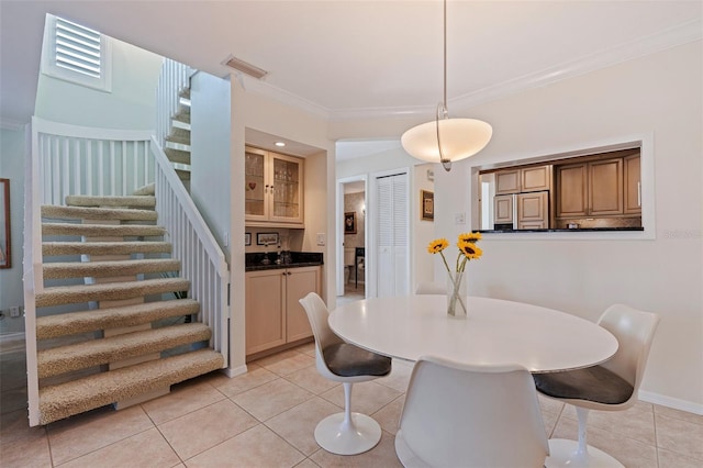 dining area with visible vents, ornamental molding, stairway, and light tile patterned floors