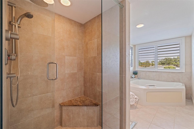 bathroom with tile patterned floors, recessed lighting, a stall shower, and a bath