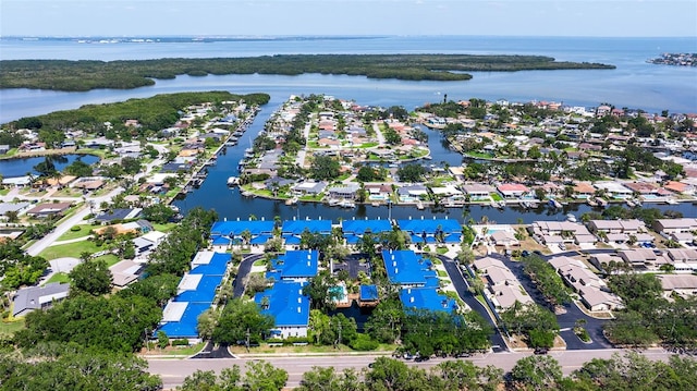 drone / aerial view featuring a water view and a residential view