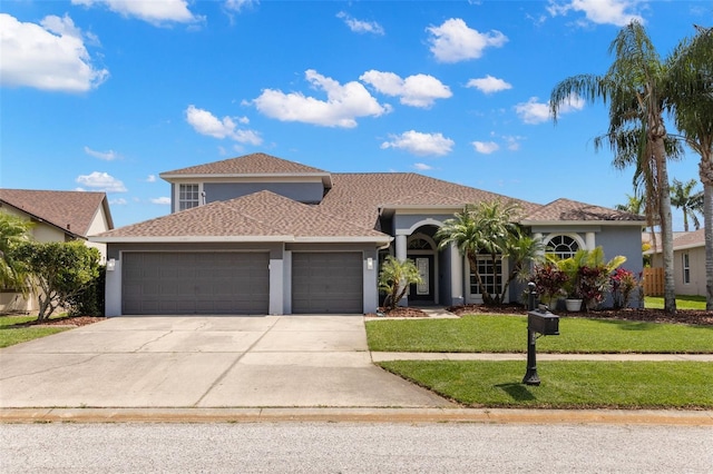 mediterranean / spanish-style home with concrete driveway, a front lawn, a garage, and stucco siding