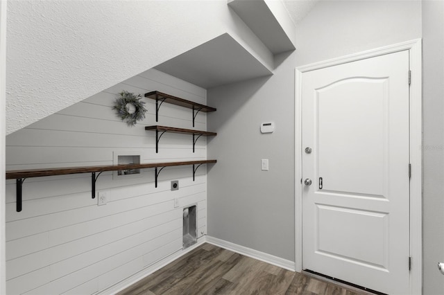 clothes washing area featuring hookup for an electric dryer, dark wood-style floors, baseboards, hookup for a washing machine, and laundry area