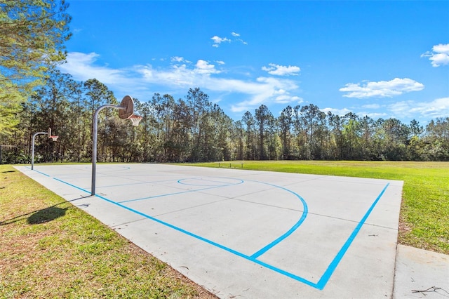 view of sport court featuring community basketball court and a lawn
