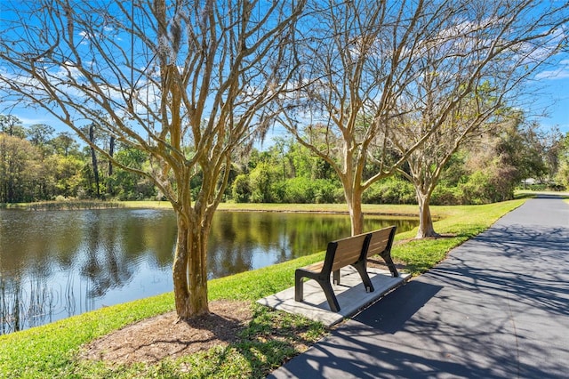 surrounding community featuring a water view
