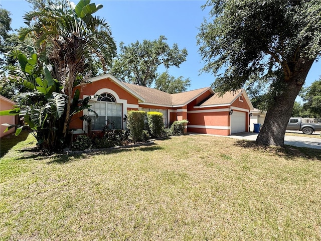 ranch-style house featuring a front lawn, an attached garage, and stucco siding