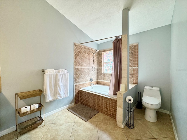 full bathroom featuring tile patterned floors, baseboards, tiled shower / bath combo, and toilet
