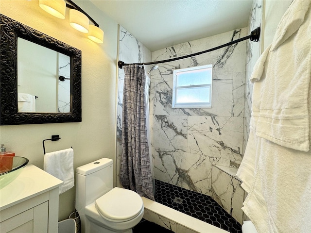full bath with toilet, a stall shower, and vanity