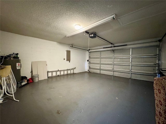garage featuring a garage door opener, water heater, and electric panel
