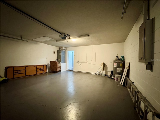 garage featuring electric panel, water heater, heating unit, a garage door opener, and concrete block wall