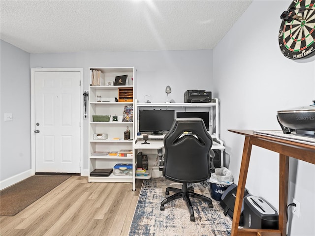 office with a textured ceiling and wood finished floors