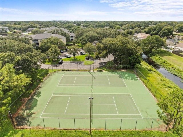 view of sport court featuring fence
