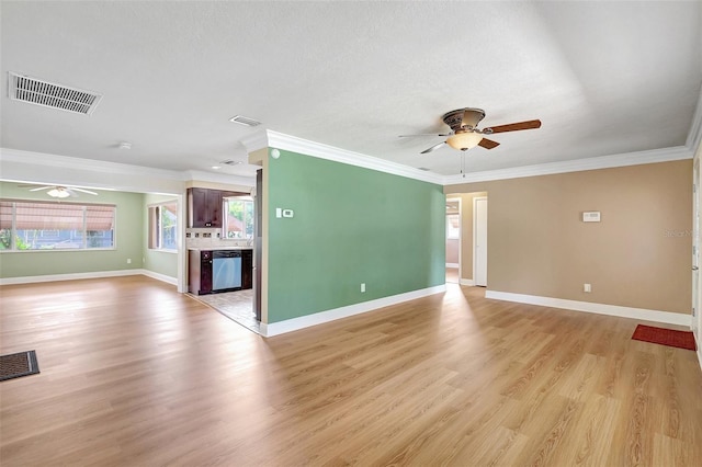 3065 Merrill Ave, Clearwater, FL 33759 - unfurnished living room with a ceiling fan, light wood-style flooring, crown molding, and baseboards
