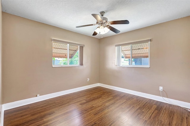 3065 Merrill Ave, Clearwater, FL 33759 - spare room with wood finished floors, baseboards, and a ceiling fan