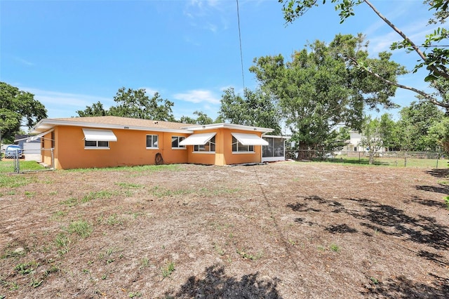 3065 Merrill Ave, Clearwater, FL 33759 - back of property featuring stucco siding and a sunroom