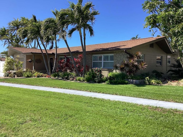 101 Madonna Blvd, Saint Petersburg, FL 33715 - ranch-style house featuring a front yard