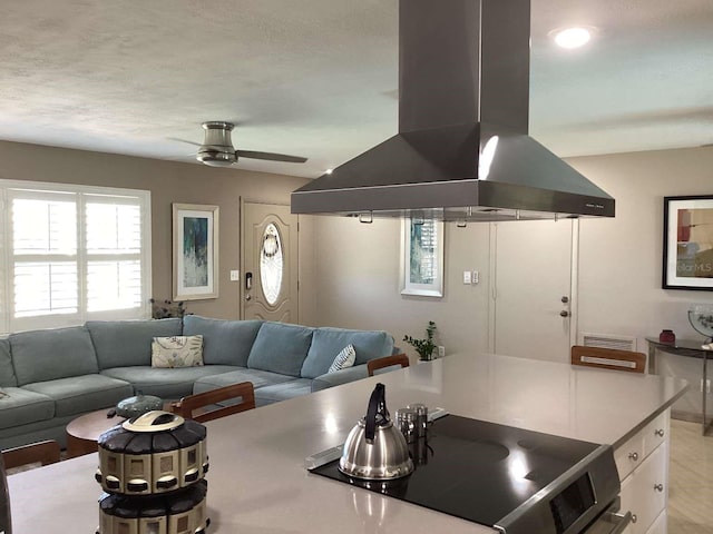 101 Madonna Blvd, Saint Petersburg, FL 33715 - kitchen featuring stainless steel electric stove, island exhaust hood, a ceiling fan, and open floor plan