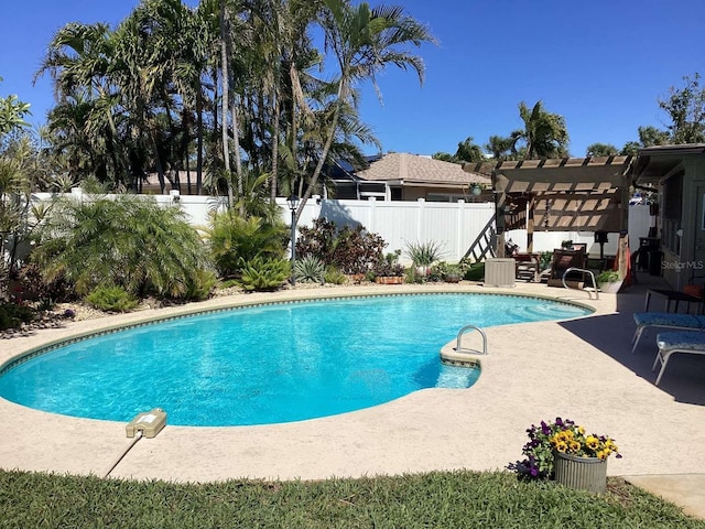 101 Madonna Blvd, Saint Petersburg, FL 33715 - view of swimming pool featuring a fenced backyard, a pergola, a patio area, and a fenced in pool