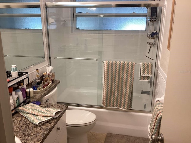 101 Madonna Blvd, Saint Petersburg, FL 33715 - full bath featuring enclosed tub / shower combo, toilet, vanity, and tile patterned floors