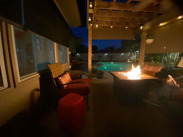 101 Madonna Blvd, Saint Petersburg, FL 33715 - pool at night with a pergola, a fenced in pool, a fire pit, and a patio