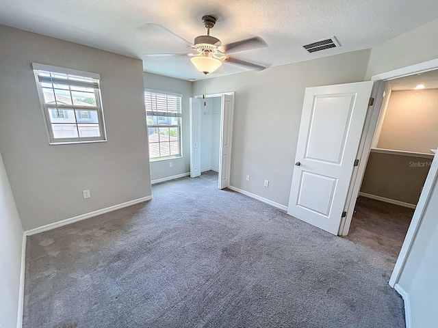 4456 Globe Thistle Dr, Tampa, FL 33619 - unfurnished bedroom with carpet floors and a ceiling fan