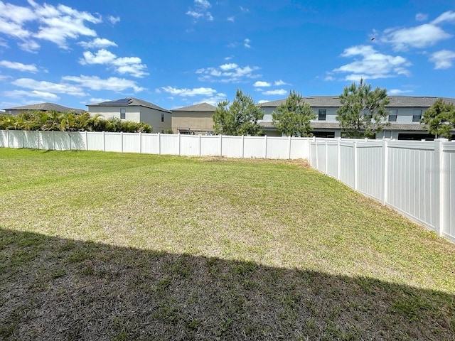 4456 Globe Thistle Dr, Tampa, FL 33619 - view of yard with a residential view
