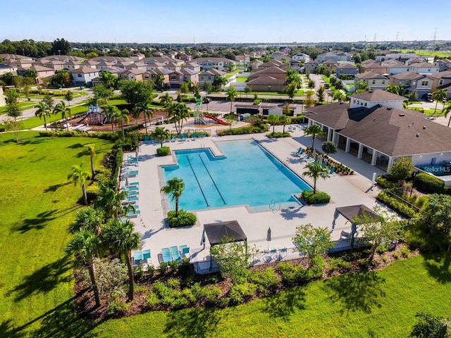 4456 Globe Thistle Dr, Tampa, FL 33619 - community pool featuring a residential view and a patio