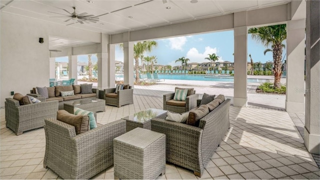 4456 Globe Thistle Dr, Tampa, FL 33619 - view of patio with ceiling fan, an outdoor living space, and a community pool