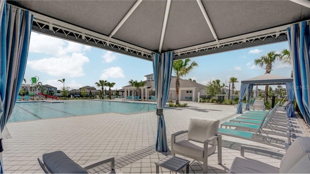 4456 Globe Thistle Dr, Tampa, FL 33619 - community pool with a gazebo and a residential view