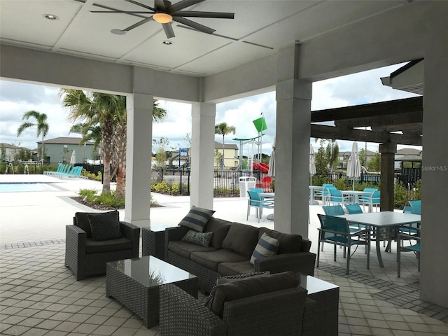 4456 Globe Thistle Dr, Tampa, FL 33619 - view of patio with a ceiling fan, outdoor lounge area, outdoor dining area, and a community pool