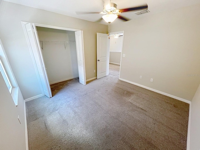 4456 Globe Thistle Dr, Tampa, FL 33619 - unfurnished bedroom with carpet flooring, a closet, and a ceiling fan