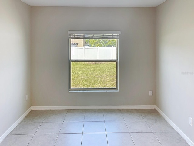 4456 Globe Thistle Dr, Tampa, FL 33619 - unfurnished room featuring light tile patterned floors and baseboards