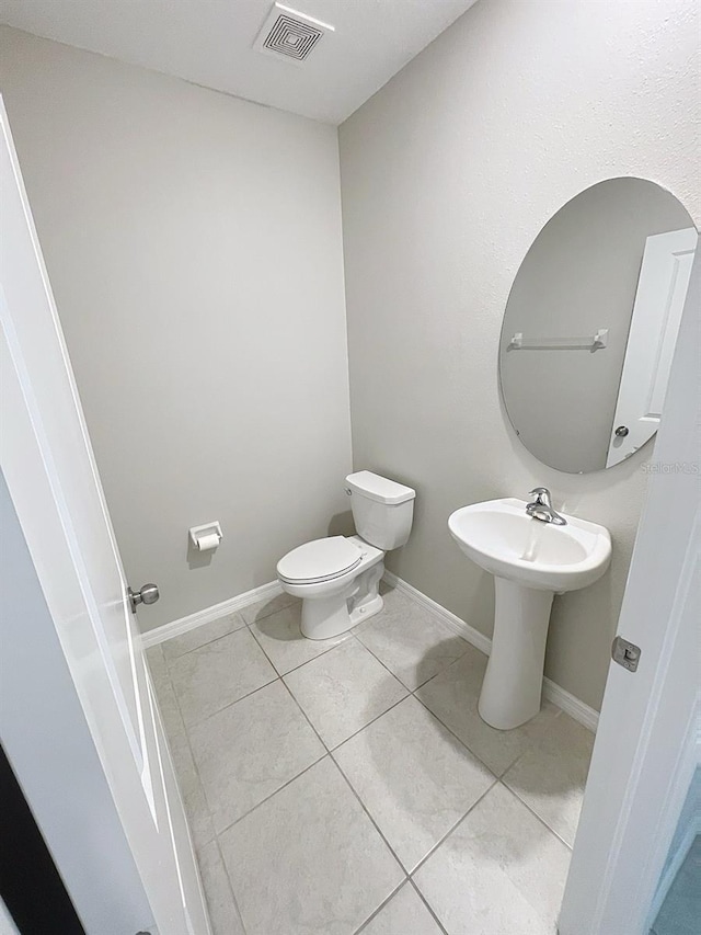4456 Globe Thistle Dr, Tampa, FL 33619 - half bath with toilet and tile patterned flooring