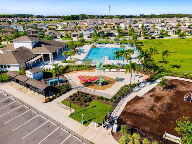 4456 Globe Thistle Dr, Tampa, FL 33619 - aerial perspective of suburban area with a pool area