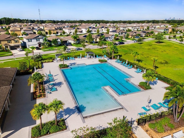 4456 Globe Thistle Dr, Tampa, FL 33619 - community pool with a residential view
